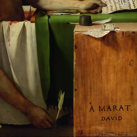 Marat assassiné/Musées royaux des Beaux-Arts de Belgique (Bruxelles In his right hand, a quill, in his left, a letter, There's a second quill by the inkpot (Credit:Marat assassiné/Musées royaux des Beaux-Arts de Belgique (Bruxelles)/J Geleyns)