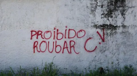 PABLO PORCIUNCULA/AFP via Getty Images Gangs like CV impose strict rules on the neighbourhoods they control, like this one in the city in Belem.